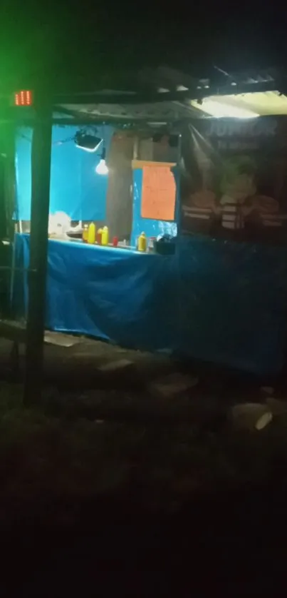 Night street food stall with blue lights and vibrant colors.