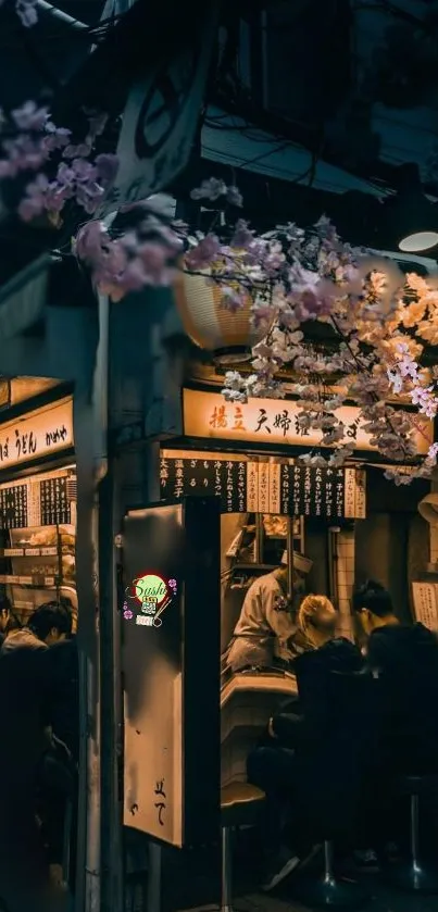 Vibrant street food scene at night with cherry blossoms overhead.