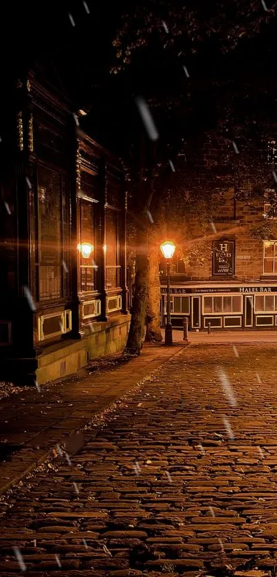 Cobblestone street at night illuminated by warm glowing lamps.