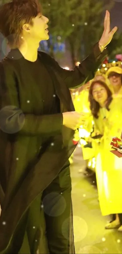 Nighttime street scene with fans under yellow lights.