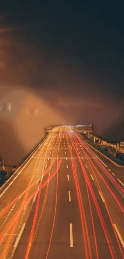 Nighttime highway with vibrant light trails.