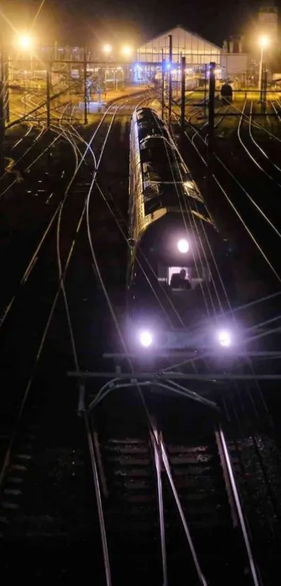 Night train on railway tracks with glowing lights.