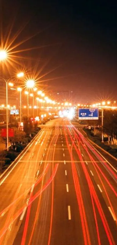 Nighttime city road with light trails and streetlights illuminating the scene.