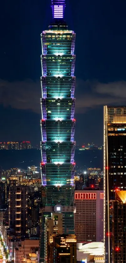 Night view of Taipei 101 skyscraper with vibrant city lights.