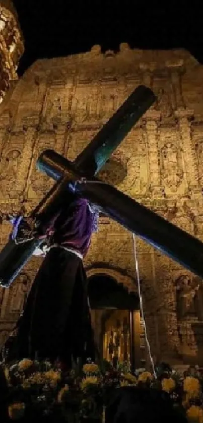 Nighttime procession before a lit cathedral.