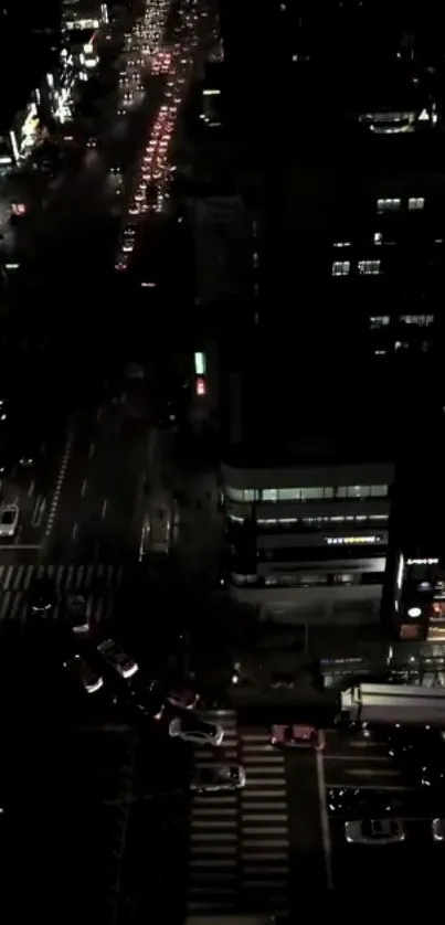 Nighttime city street with vibrant lights.