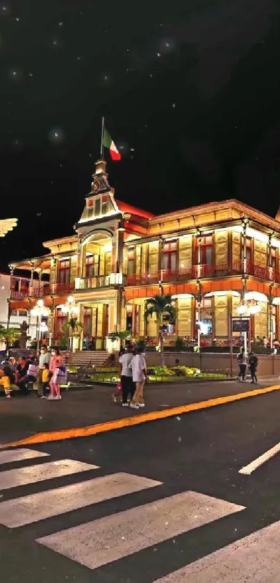 A beautifully lit historic building at night with city lights.