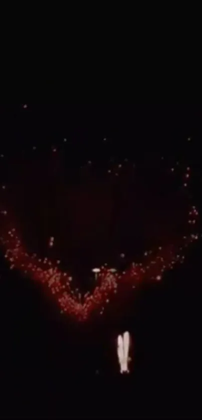 Heart-shaped fireworks lighting up the night sky, perfect for mobile wallpaper.