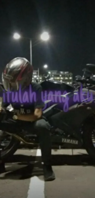 Motorcycle rider with helmet under streetlights at night with a Yamaha bike.