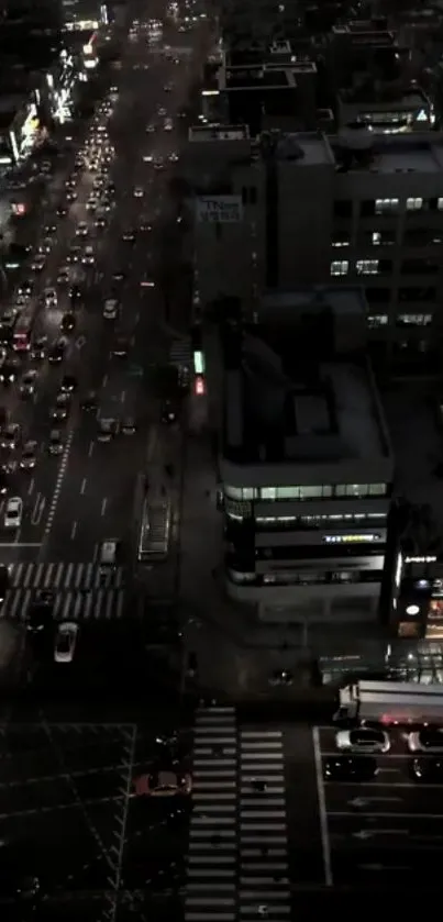 Nighttime urban street with traffic and city lights.