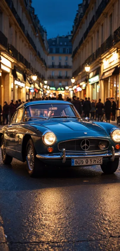 Vintage car on a lit street at night.