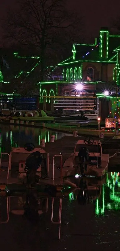 Night view of waterfront with green glowing reflections on the water and buildings.