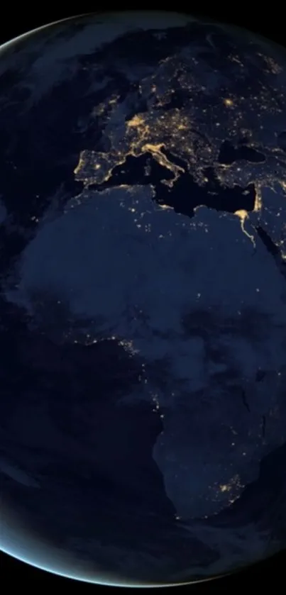 Night view of Earth from space, highlighting glowing city lights.