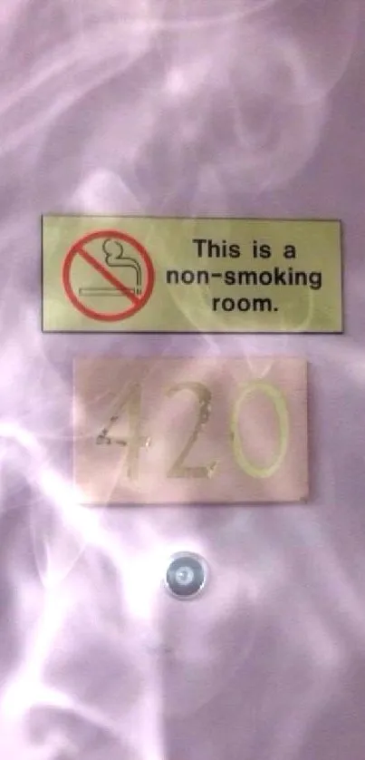 Non-smoking room door with number 420 and a pink background.