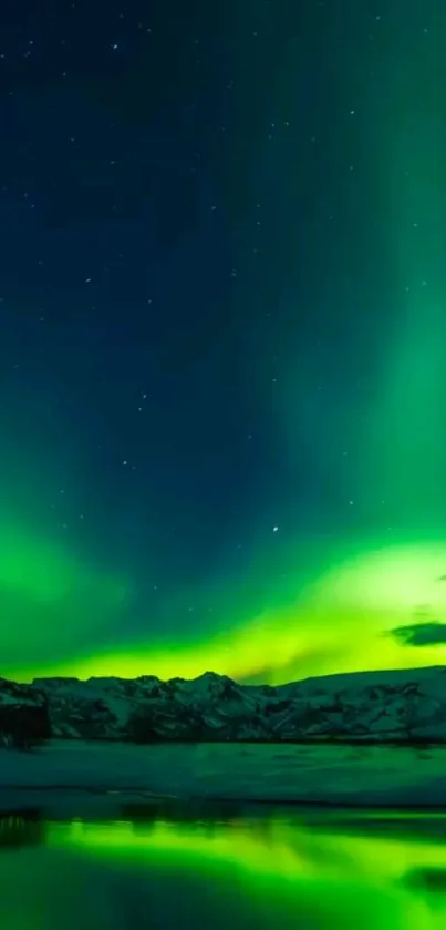 Stunning Northern Lights illuminating a dark sky over snowy mountains.