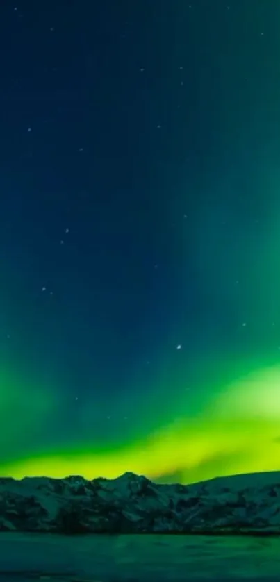 Northern Lights wallpaper with green auroras over mountains.