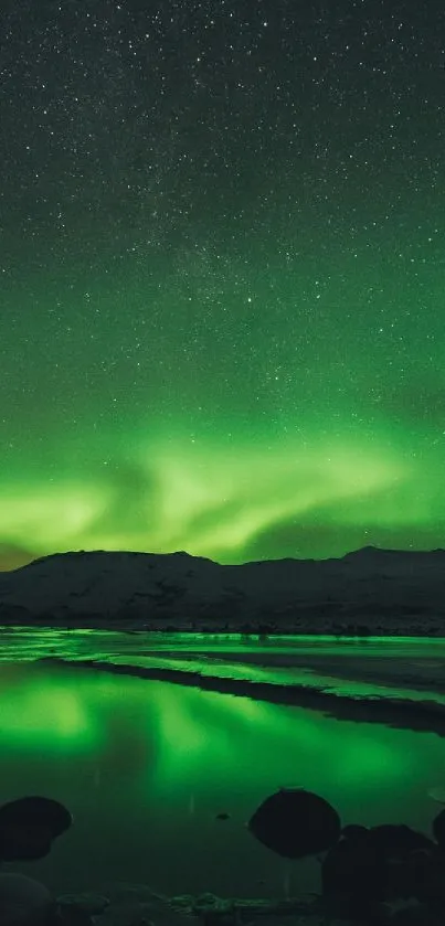 A stunning emerald green aurora over a serene lake at night.