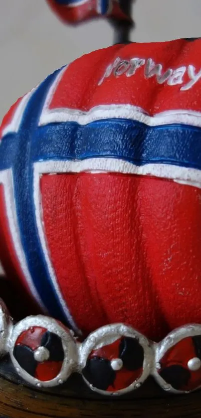 Norwegian flag sail on decorative Viking ship.