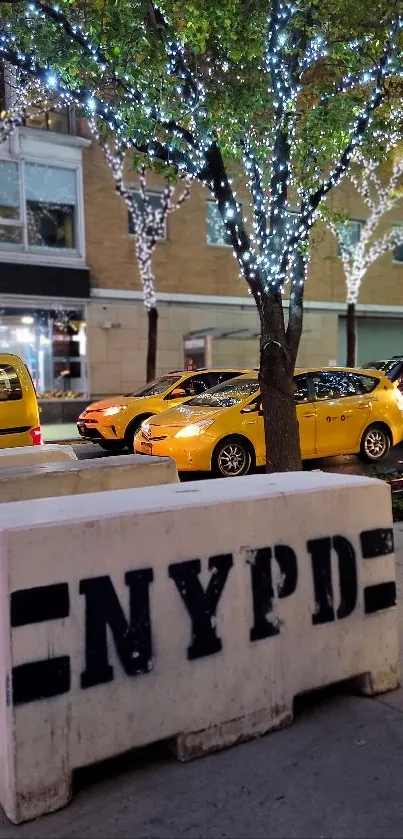 New York street with taxis and festive night lights.