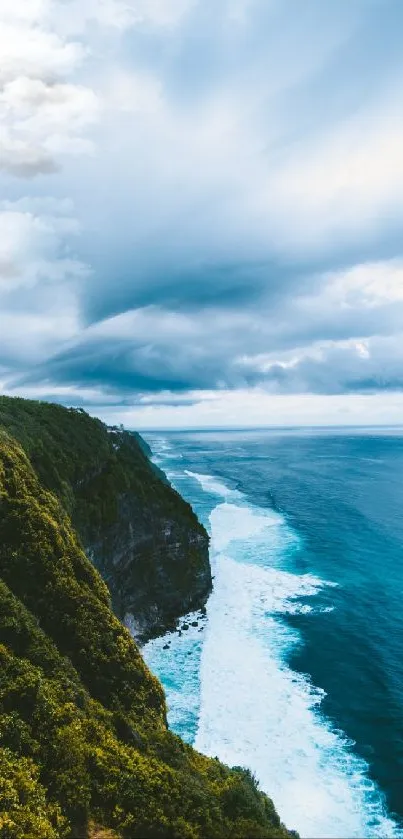 Stunning ocean cliff wallpaper with blue waters and dramatic sky.