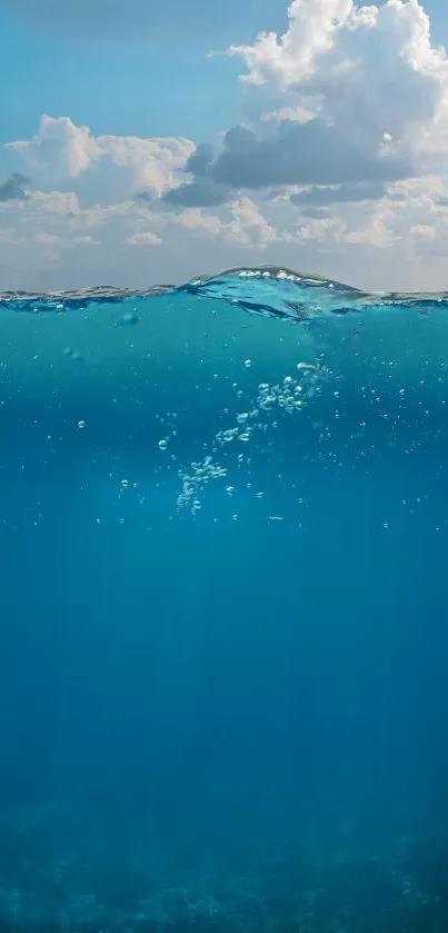 Blue ocean wallpaper with clouds above, creating a serene and calm atmosphere.