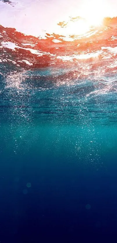 Underwater view with sunlight breaking through for mobile wallpaper.