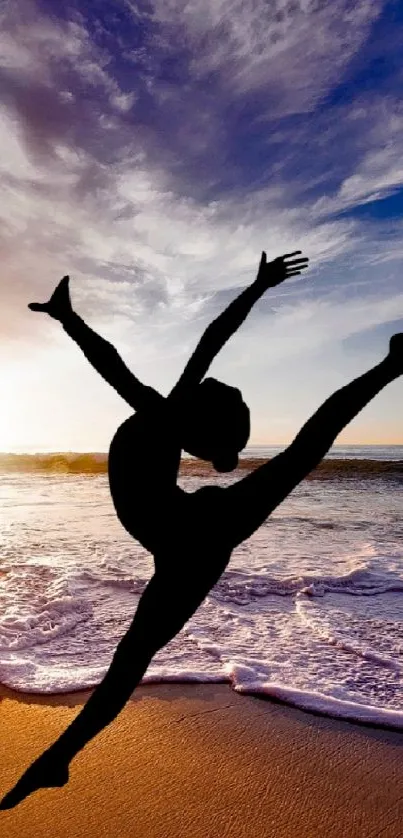 Silhouette of a dancer with an ocean sunset background.