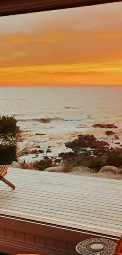 Sunset view from a deck overlooking the ocean.