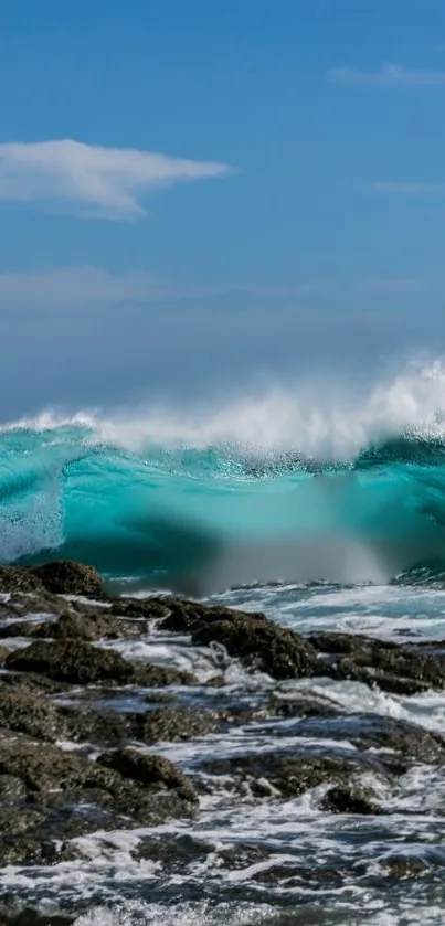 Majestic turquoise ocean wave crashing on rocky coastline.