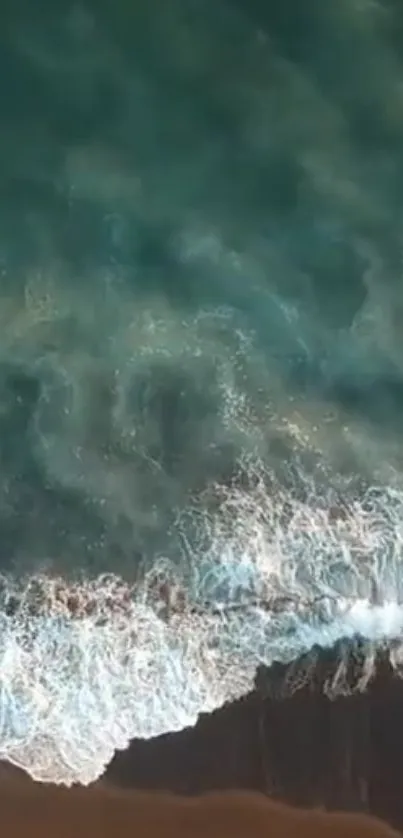 Aerial view of ocean waves with turquoise water.