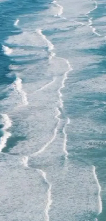 Aerial view of ocean waves creating a serene and beautiful mobile wallpaper.