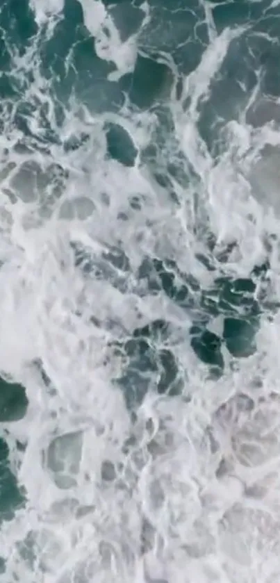 Aerial view of majestic ocean waves crashing.