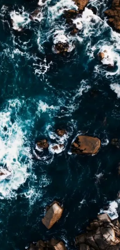 Aerial view of ocean waves crashing against rocks.