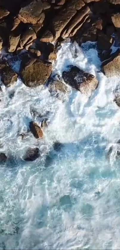 Aerial view of waves crashing on rocky coastline.