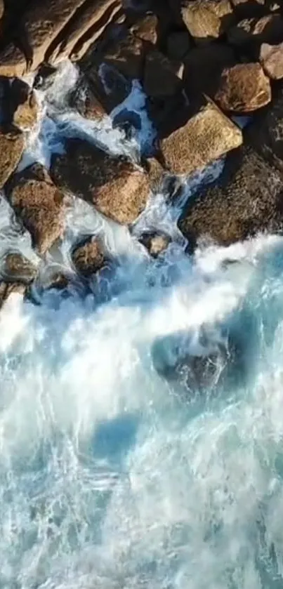 Aerial view of ocean waves crashing onto rocks.