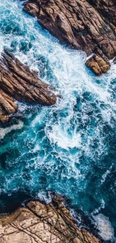 Aerial view of ocean waves and rocks creating a dynamic and vibrant seascape.