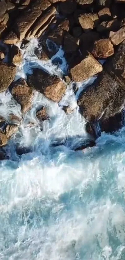 Waves crash against rocks in a serene ocean scene.