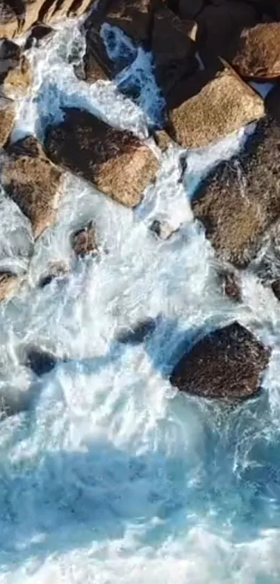 Aerial view of ocean waves crashing onto rocks.