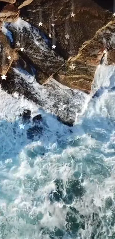 Aerial view of ocean waves crashing against rocks with star accents.