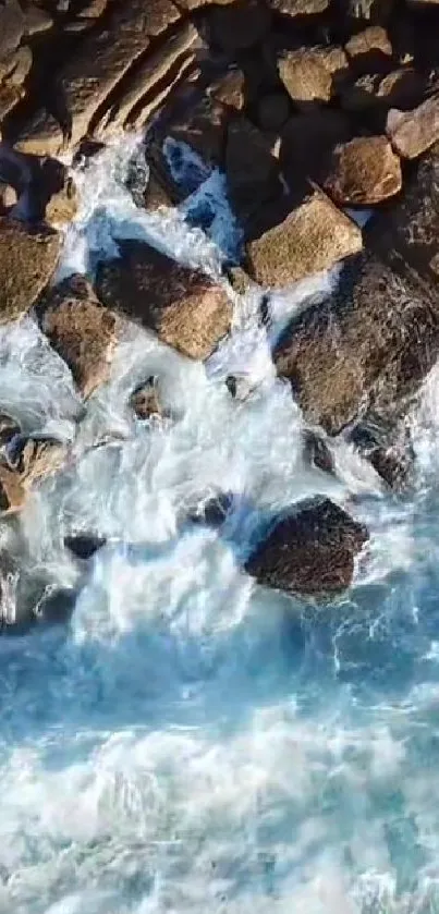 Aerial view of ocean waves crashing on rocky shore.