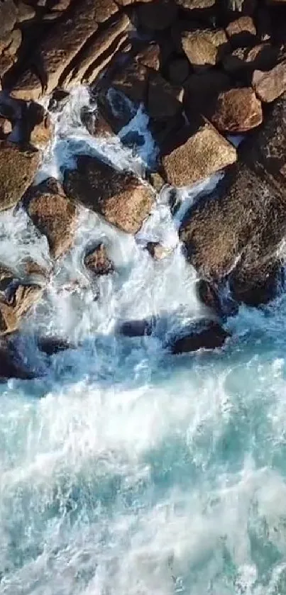 Aerial view of ocean waves crashing against rocky shore.