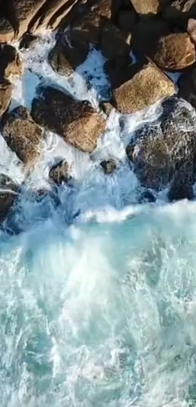 Aerial view of waves crashing against rocky coastline.