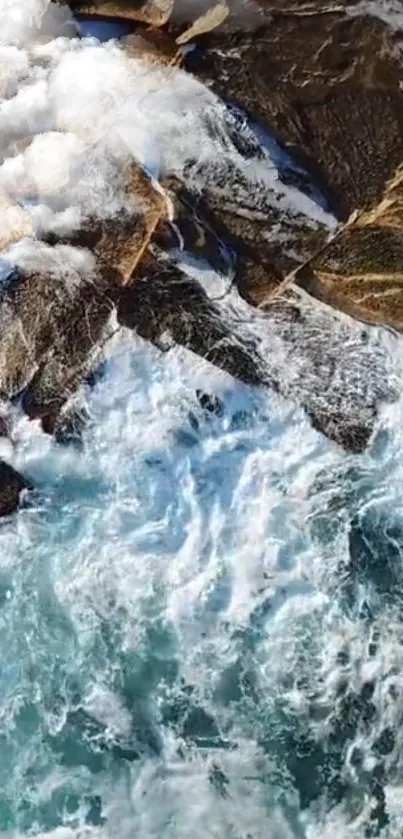 Aerial view of ocean waves meeting rocky coast.