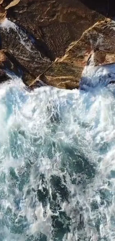 Aerial view of ocean waves crashing on a rocky shore in a vibrant wallpaper.