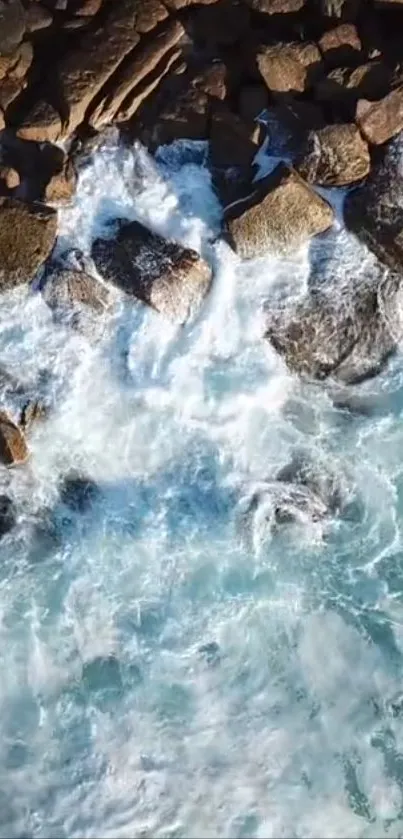 Waves crashing against rocky shoreline with clear blue water.