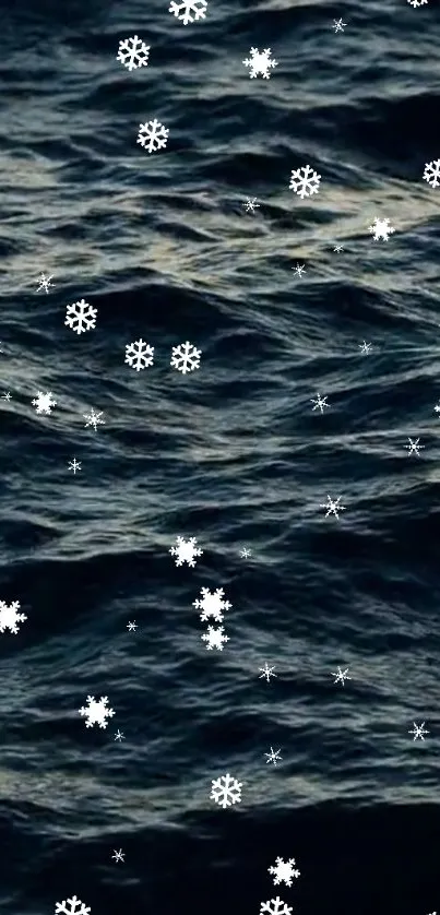 Dark ocean waves with snowflakes overlay mobile wallpaper.