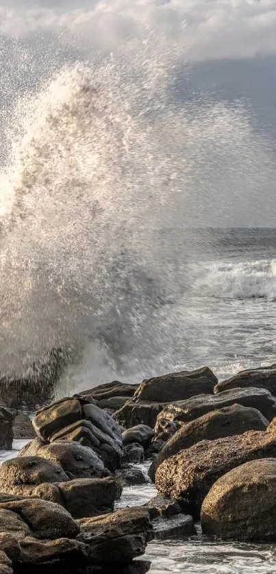 Dynamic ocean waves crash against coastal rocks under a cloudy sky.