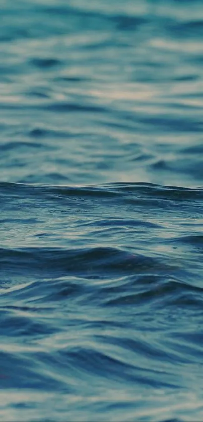 Serene ocean waves mobile wallpaper in dark cyan colors.