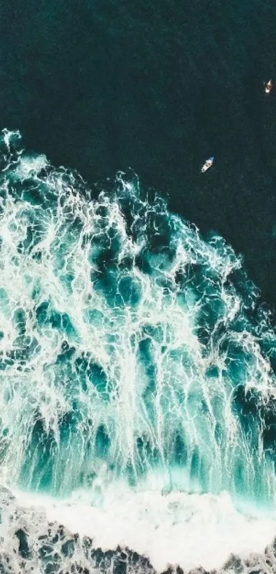 Aerial view of ocean waves crashing with surfers nearby.