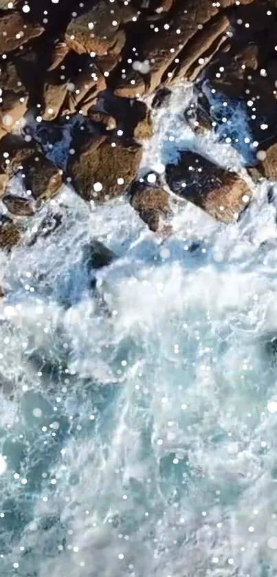 Aerial view of ocean waves crashing against rocky shore with white foam.